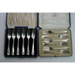 Two cased sets of silver pastry forks London and B