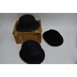 Two bowler hats, one boxed and a silk top hat by G