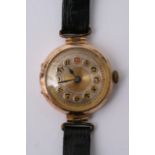 A 9ct rose gold ladies wrist watch with arabic num