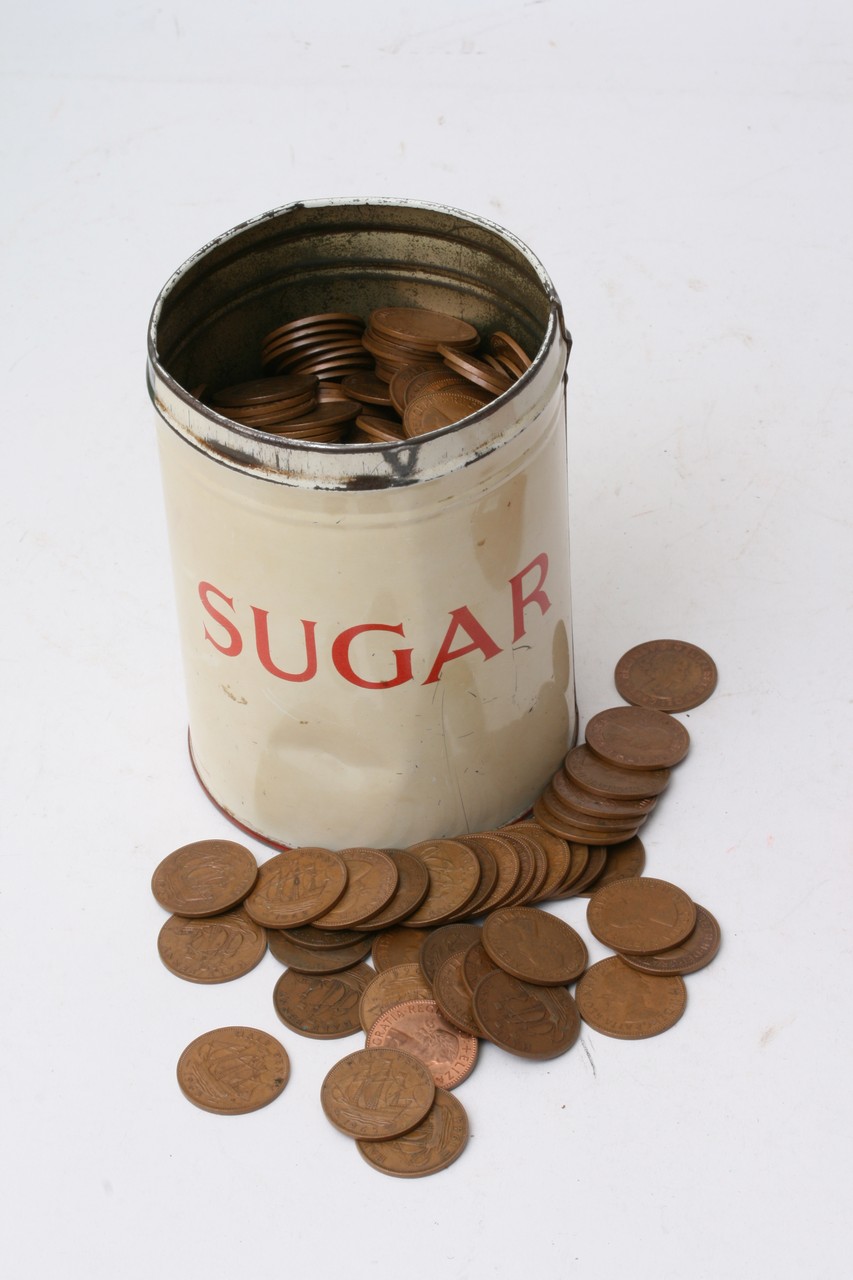 A tin of old coins including half pennies etc.