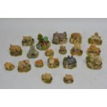 A box containing 19 Lilliput Lane cottages with pa