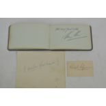 An autograph book containing signatures including