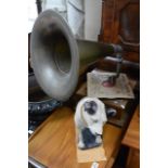 A vintage gramophone and a large modern HMV dog fi