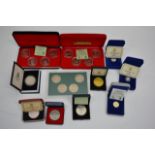 A collection of various cased Pobjay coins includi