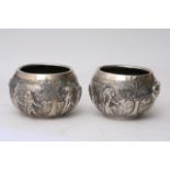 A pair of Continental silver jardinieres depicting
