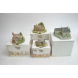 A collection of Lilliput lane cottages and other v