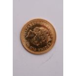 A gold half sovereign dated 2000.