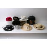 A collection of vintage hats including a Christian