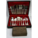 A Canteen of silver plated cutlery and a carved bo