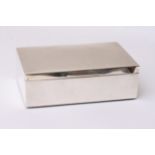 A silver cigarette case of rectangular shape with