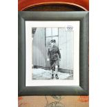 A mounted and frame signed Norman Wisdom photo