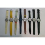 A collection of six advertising watches