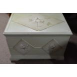 A white painted box the rectangular top painted wi