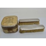 An Art Deco brush set and two silver backed brushe