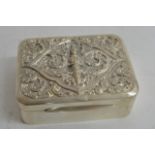 An Indian silver cigarette box, the lid with deity