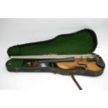 A cased violin with no label, accompanied by two b