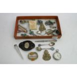 A box of silver objects including a watch, buttons