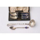 A Scottish silver sifting spoon and three other si