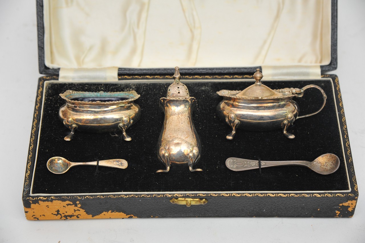 A cased silver condiment set Birmingham hallmarks