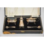 A cased silver condiment set Birmingham hallmarks