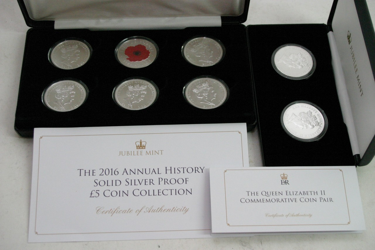 A Jubilee mint cased set of six silver proof £5 co