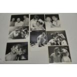 A collection of 8 original press photos depicting