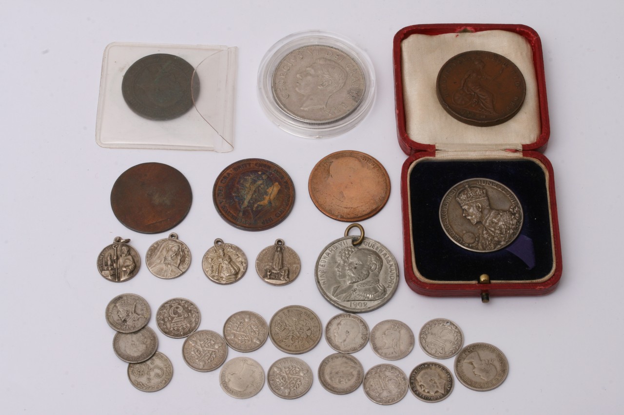 A collection of various coins including an 1854 pe