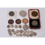 A collection of various coins including an 1854 pe