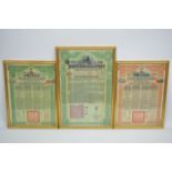 Three framed and glazed Chinese government bonds.