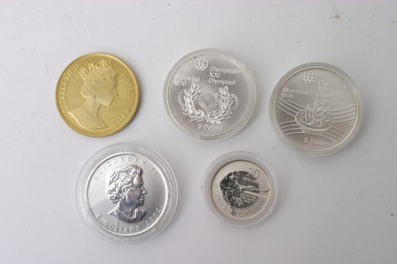 A collection of coins including a gold plated 1918