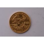 A gold 5 dollar coin, approx 3.4g.