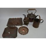 A small collection of copperware including a kettl