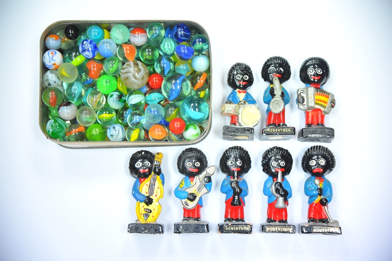 Eight Robertson's golly musician figures and a tin