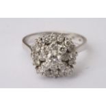 A white gold diamond cluster ring, approximate size V