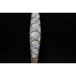 A 9ct gold bracelet set with opals and diamonds, a