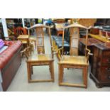 A pair of late 19th Century Chinese ornately carved scholars chairs.