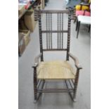 An ash and beech rocking chair designed by Ernest