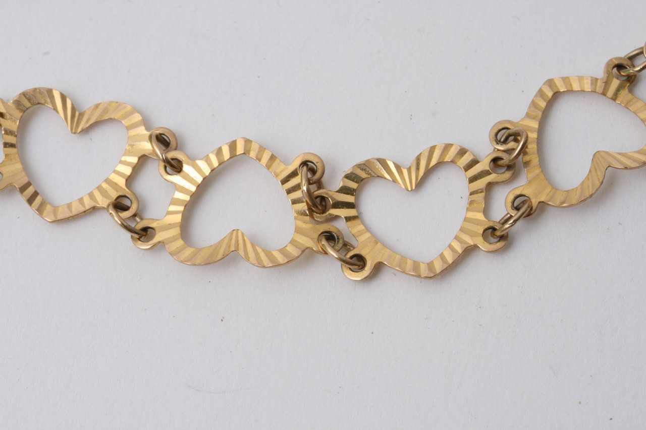 A 9ct gold bracelet in the form of linked hearts, - Image 2 of 2