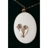 A 9ct gold and ivory pendant.