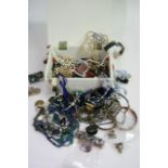 A jewellery box containing costume necklaces and o