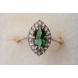 A 9 carat diamond and peridot stone ring. (weight 2g including stones)