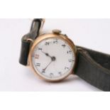 A 9ct gold ladies 15 jewels wristwatch with arabic numerals, the number twelve being red, mounted on