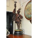A large Spelter figure of a Knight holding a lamp height 90cm not including base,