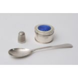 A small silver and enamel pill box, spoons, and th