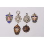 Six enamel and silver miniature medals comprising of three Wales sports miniature medals, a