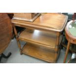 An Ercol type tea trolley with three shelves, approximate measurements of 81cm wide x 48cm deep x