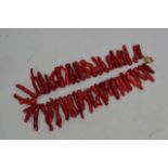 A coral necklace, length approx 52cm.