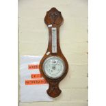 An oak cased mercury filled banjo barometer.