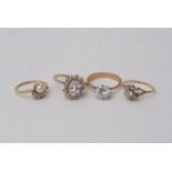 Four Gold Rings Set with CZ Stones