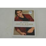 A signed Justin Bieber book "just getting started"